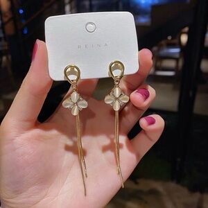 Gold Floral Drop Earrings with White Petal Accents